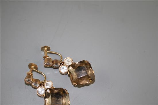 A pair of 9ct, smoky quartz and white paste set drop ear clips, drop 37mm, gross weight 13.5 grams.